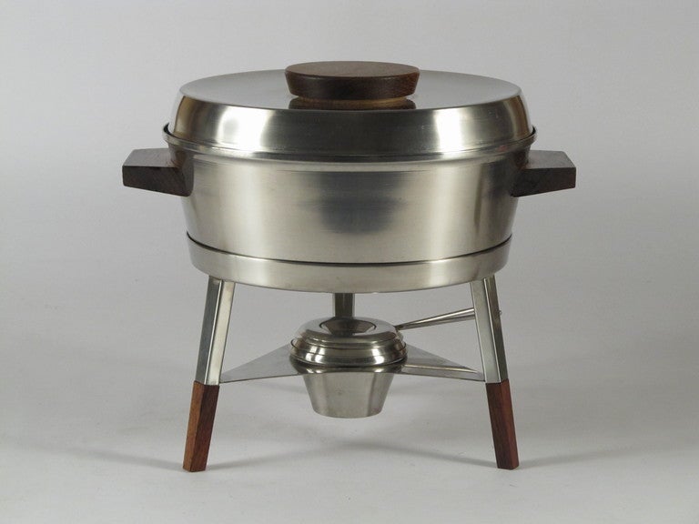 Stelton, from Denmark made this clean line stainless steel and rosewood chafing dish.  The burner is made for denatured alcohol fuel.  