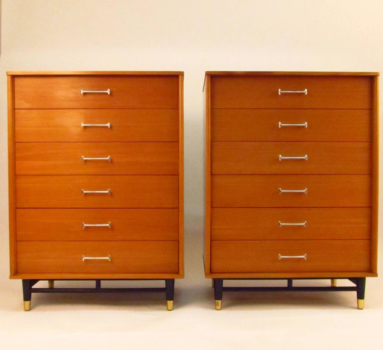 Very fine pair of dressers from the mid-1950s. Both pieces have a date code on the back of 1/54. Each drawer has dovetail construction and a cedar bottom.