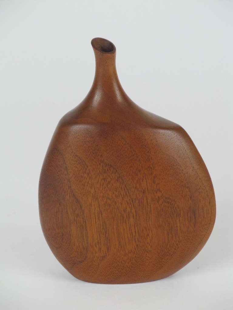 This organic and beautiful carved decorative bottle is made from one solid piece of black walnut, as indicated with the signature.