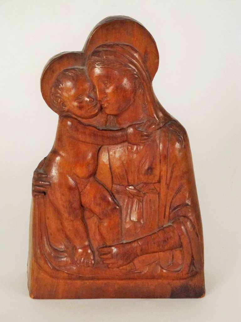 Unsigned, but beautifully carved, Madonna and Child, and an unknown (by me) saint.  Probably European in origin, circa the 1920's.  No marks or signatures, because they were most likely carved by monks in a monastery.