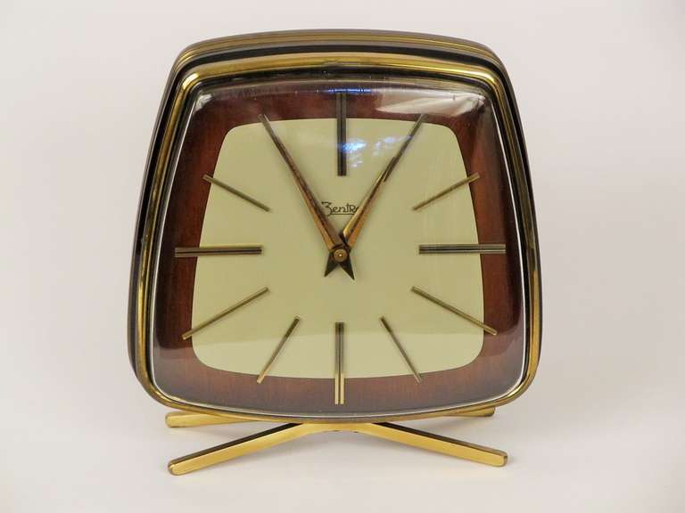 This beautiful German made clock has a melodic hour and half hour chime, with separate windings and springs, so one can disable the chimes if desired.  The face  and body are high gloss lacquer finish that German cabinet makers are known for.