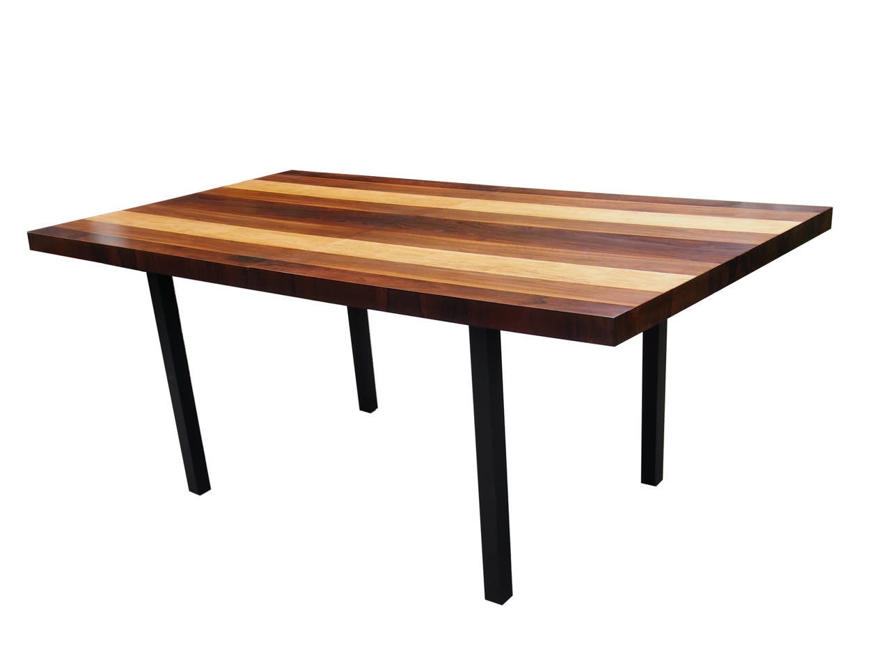 This stunning table was designed by Milo Baughman for Directional in the early 1960s. The top is made of rosewood, walnut and ash and the rectilinear base is ebonized wood. The design is modern and sleek, perfect for showcasing the juxtaposed woods.