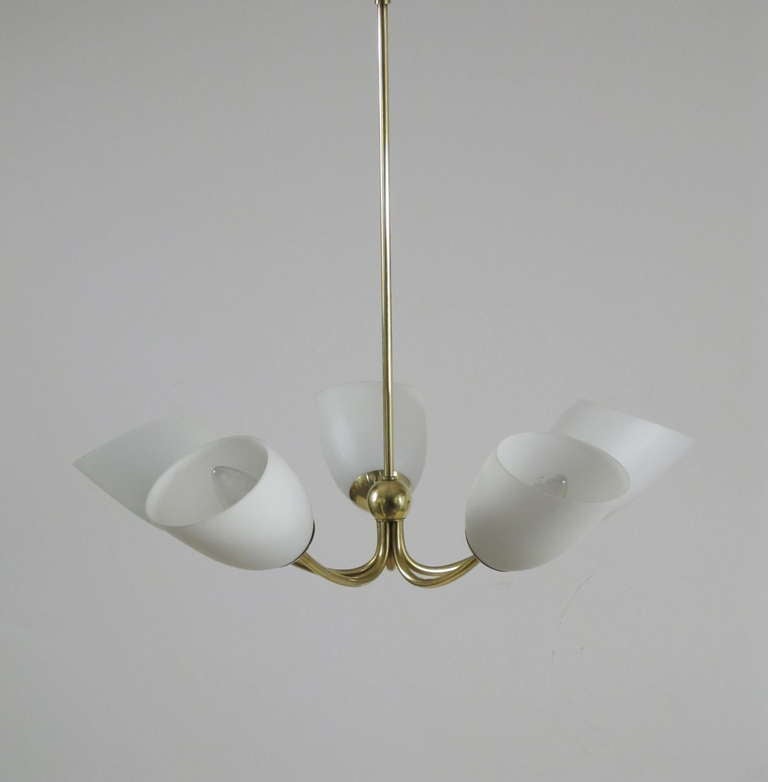 Made of all solid brass, with the original ceiling cap.  Each shade is frosted white glass with a bias cut top.  