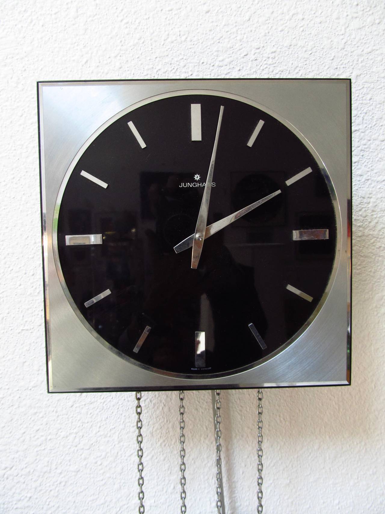 A very smart and Minimalist modern take on the traditional pendulum wall clock from Germany. It has chimes for the hour and half hour, that can be easily turned on or off with a small lever on the side of the case. Each chime has two notes, and they
