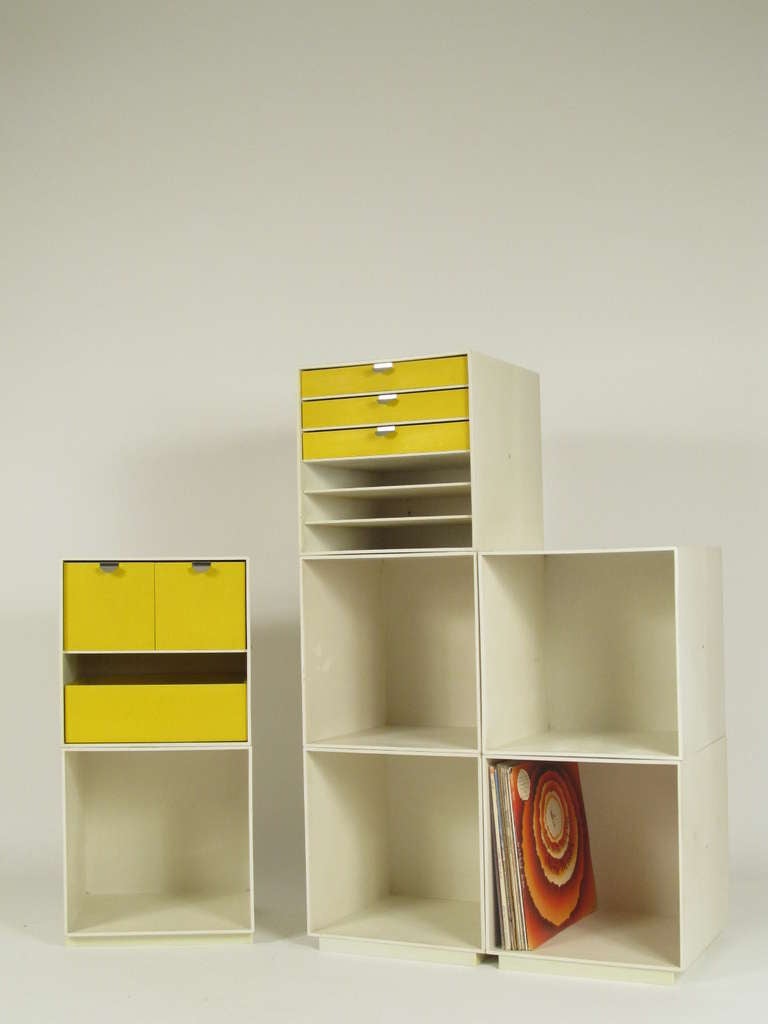 The set consists of 3 platform bases, 5 plain cubes, and 2 cubes with drawers.  Each piece measures 13.5 inches one all sides.
