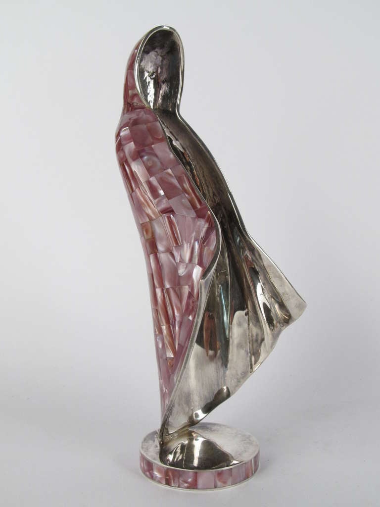 Made by Los Castillos in Mexico, from silver plated copper, and encased in mosaic abalone shell.