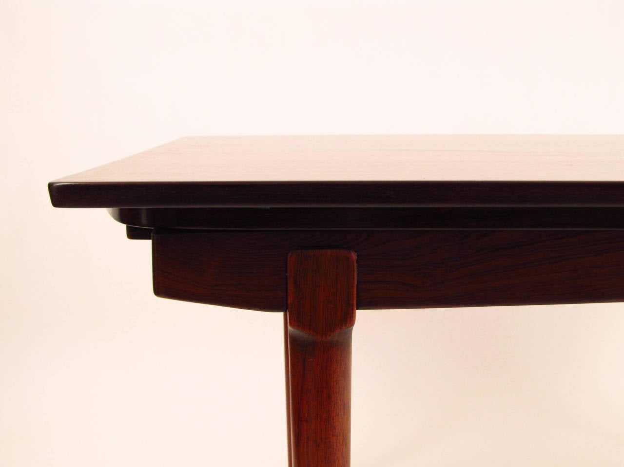 This is a stunningly attractive piece of Scandinavian design. There are no makers marks, but the style and craftsmanship is undeniably Scandinavian, probably Danish or Norwegian. It has curved sides, and with the leaves extended, the gentle curve