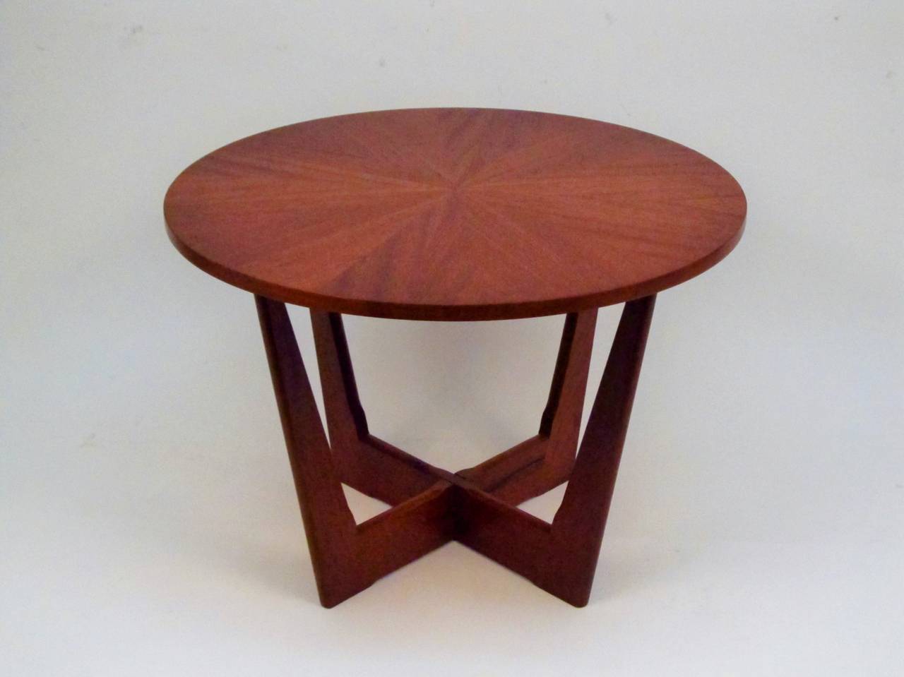 This little gem can be used either as an end or lamp table or a coffee table. A simple but beautiful construction, where the X-base pieces interlock, and the base is doweled into the top, using no hardware. Designed by the son of the famous Danish