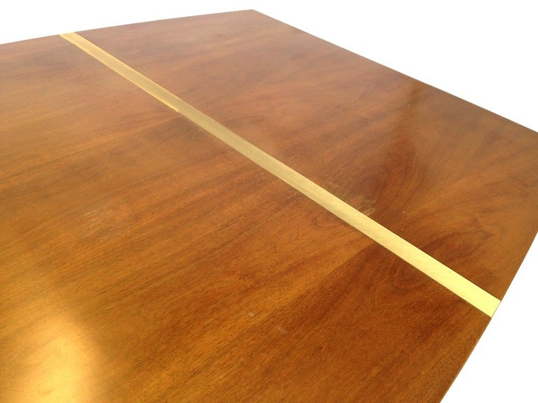 Mid Century 8 ft. Walnut Surfboard Shaped Dining Table with Brass Inlays.  This table has some light wear to the finish as well as some small dings and minor chips.  It is being sold in as found condition and should be re-finished.