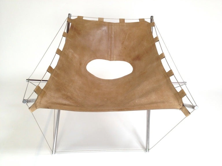 Tension Lounge Chair by J.H. Varichon.  Original condition.  Leather seat has some scuffs and scratches from use.  The 2 front loops are intact but need to be refastened (see pictures 9 and 10).  