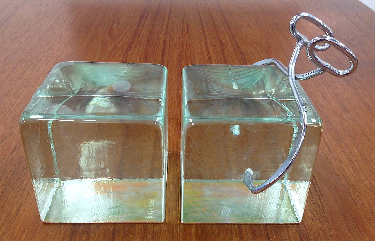 Rare pair of Curtis Jere ice block bookends. Excellent condition. Signature is no longer present. Original ice picks intact. Engraved on the underside of each block with what is presumably an inventory number.