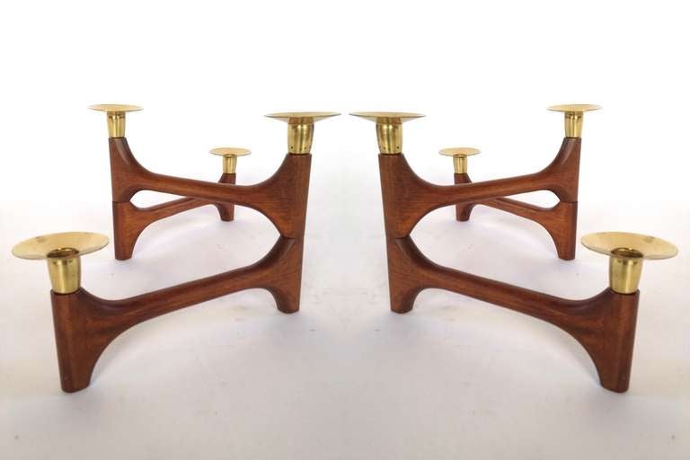 Pair of Sculptural Danish Modern adjustable Walnut Candle Stick Holders.  Can be arranged in many different configurations as shown.  Excellent condition with expected light patina to brass as shown.