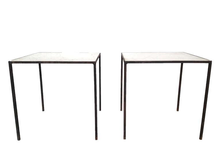 Pair of Iron End tables with Marble Tops.  Marble tops have some wear/chips to corners as pictured.