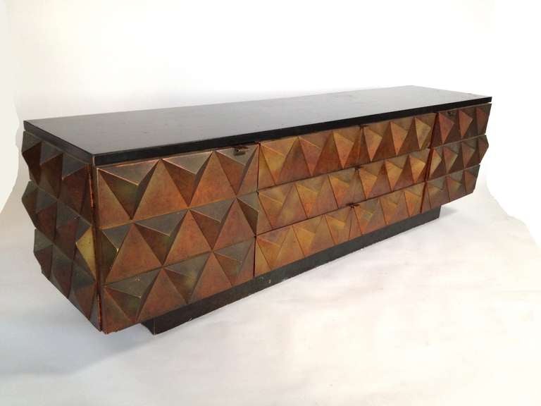Exceptional Brutalist Style Faceted Credenza.  Features 2 storage cabinets on the left and right sides with drawers in the center.  Lacquered top has some minor wear from use.  Some minor wear to credenza as pictured.