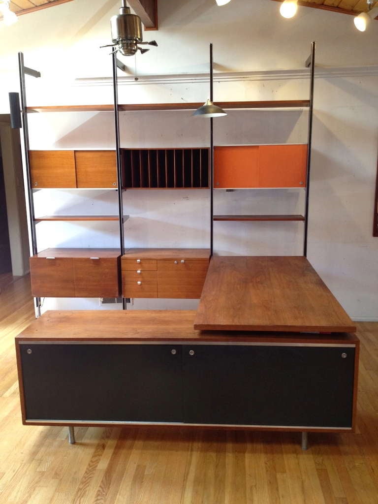 Exceptional George Nelson 3 section CSS Wall Unit with Desk and Credenza by Herman Miller.  A beautiful and exceedingly rare fully adjustable George Nelson CSS unit.  Includes 2 storage cabinets, a spacious desk surface with a classic Nelson