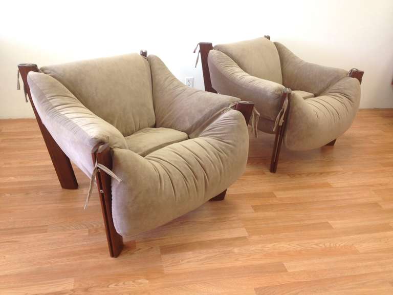 Pair of Lounge Chairs by Percival Lafer.  Recently re-upholstered in suede - in good condition with some very minor wear.  Wood legs have been recently refinished.