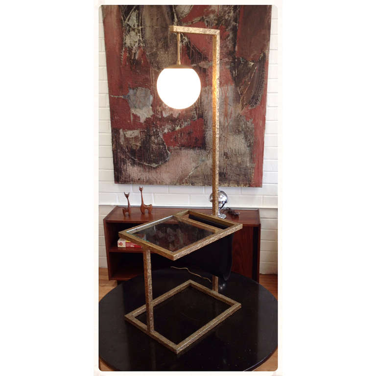 Brutalist Floor Lamp with Table and Magazine Rack.  Features a glass top table and sling magazine rack.  Wonderful brutalist style finish as pictured.  Please note lamp was rewired without an on/off switch.