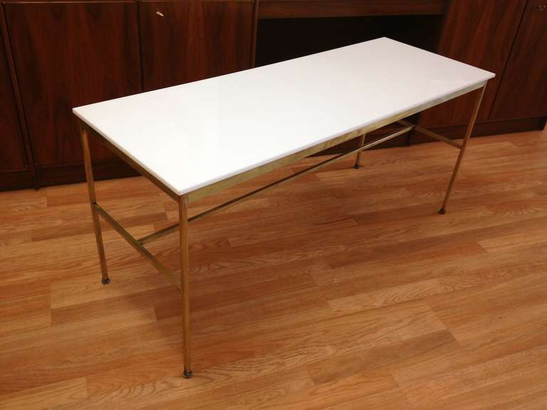 Paul McCobb Brass and Vitrolite Console Sofa Table for Calvin.  Brass has some wear from age and should be polished.  Vitrolite top is original and is in very nice condition.  Very slight bend to one leg which is not very notable.  Selling in as