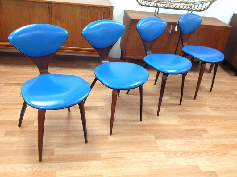 Set of 4 Norman Cherner Plycraft Dining Chairs.  Very nice condition.  The legs on all 4 chairs were recently restored (veneer repairs) and were refinished.  Chairs are structurally very strong.  Upholstery looks to be original and is in very nice