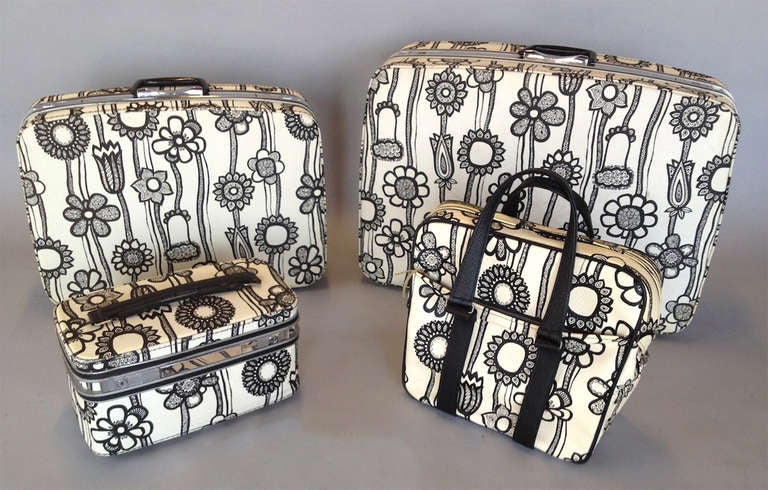 1960's Mod 4 Piece Luggage Suitcase Set by Marimekko for Samsonite.  Good original condition.  Some minor yellowing primarily to handbag.  Insides are in nice clean condition (moth ball scent) with a small rip in the larger suitcase that is not too