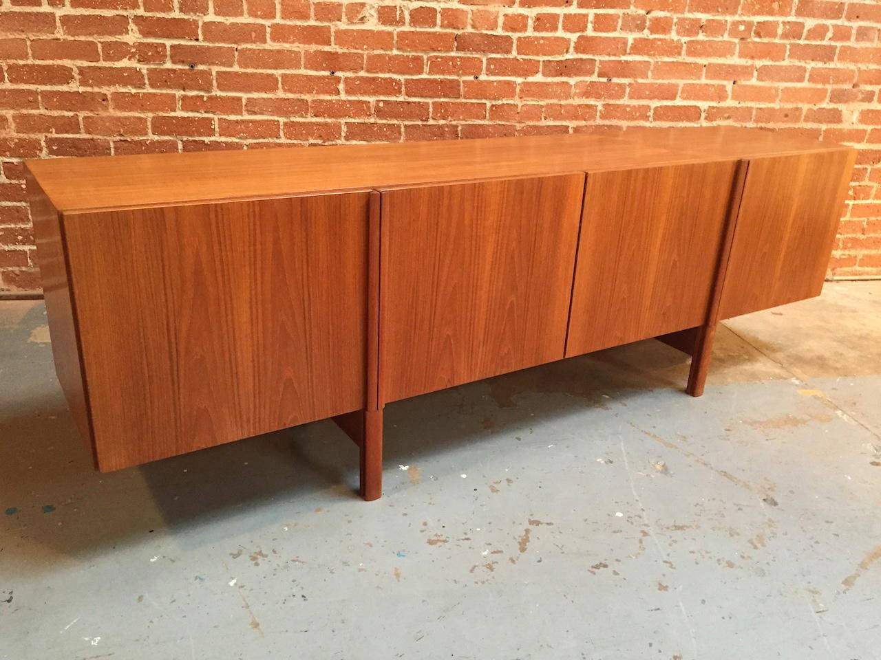 Exceptional Ib Kofod-Larsen Danish modern teak credenza for Faarup Mobelfabrik.