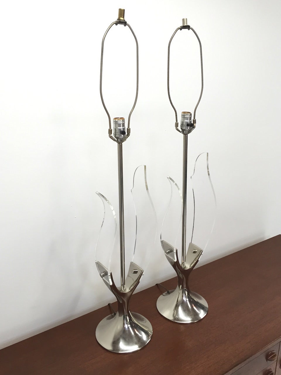 Exceptional Pair of Chrome and Lucite Table Lamps by Laurel Lamp Co.  Nice original condition.  No Shades.  Measurement is to the top of the finial.