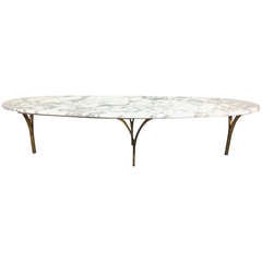 Italian Marble Top Eliptical Surfboard Coffee Table on Arched Bronze Feet