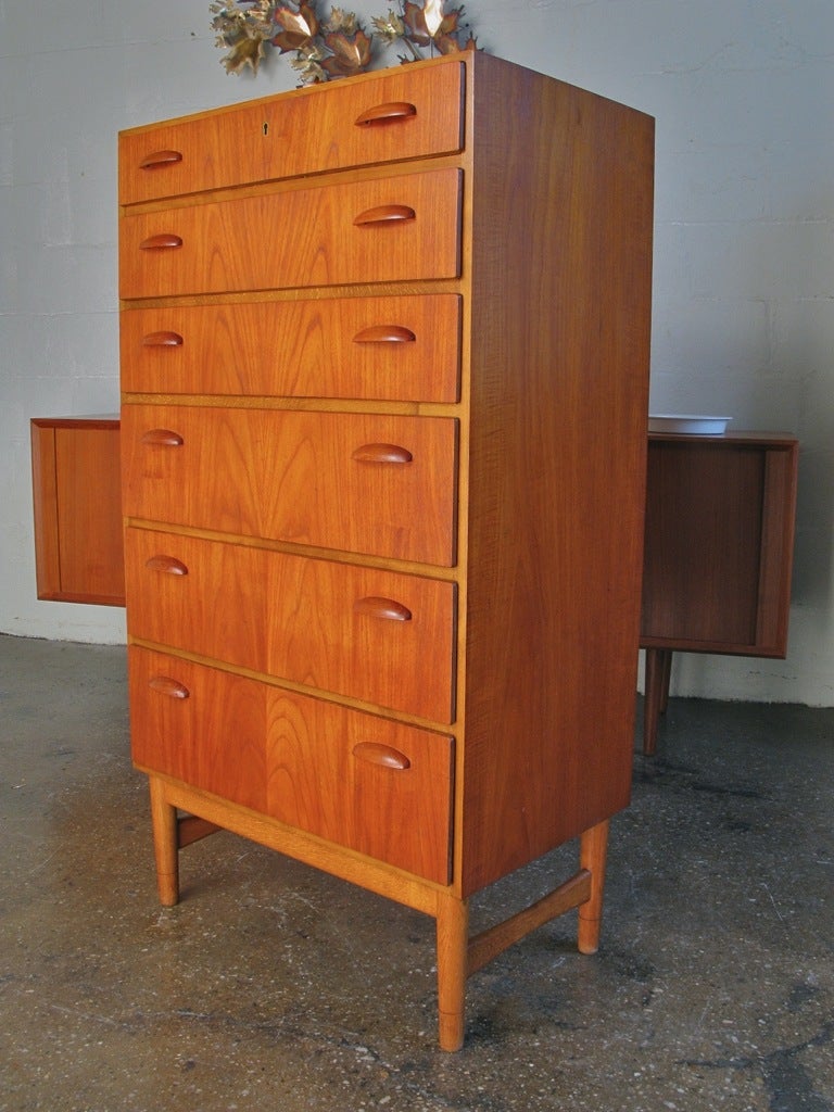 Striking tall Danish modern dresser designed by Kai Kristiansen. Three deep drawers and three shallower drawers, all with his signature 