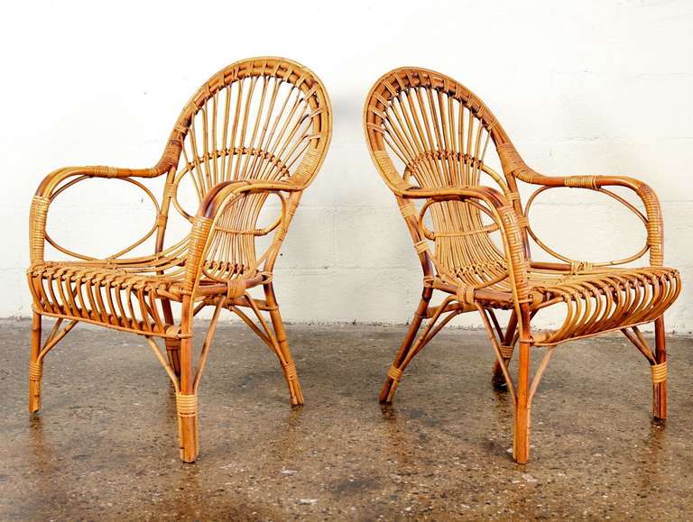 Vintage rattan chairs in the manner of Franco Albini. Just delightful! These late-1950s patio chairs are in excellent vintage condition. Use indoors or in protected outdoor area for instant mid-century charm.

24