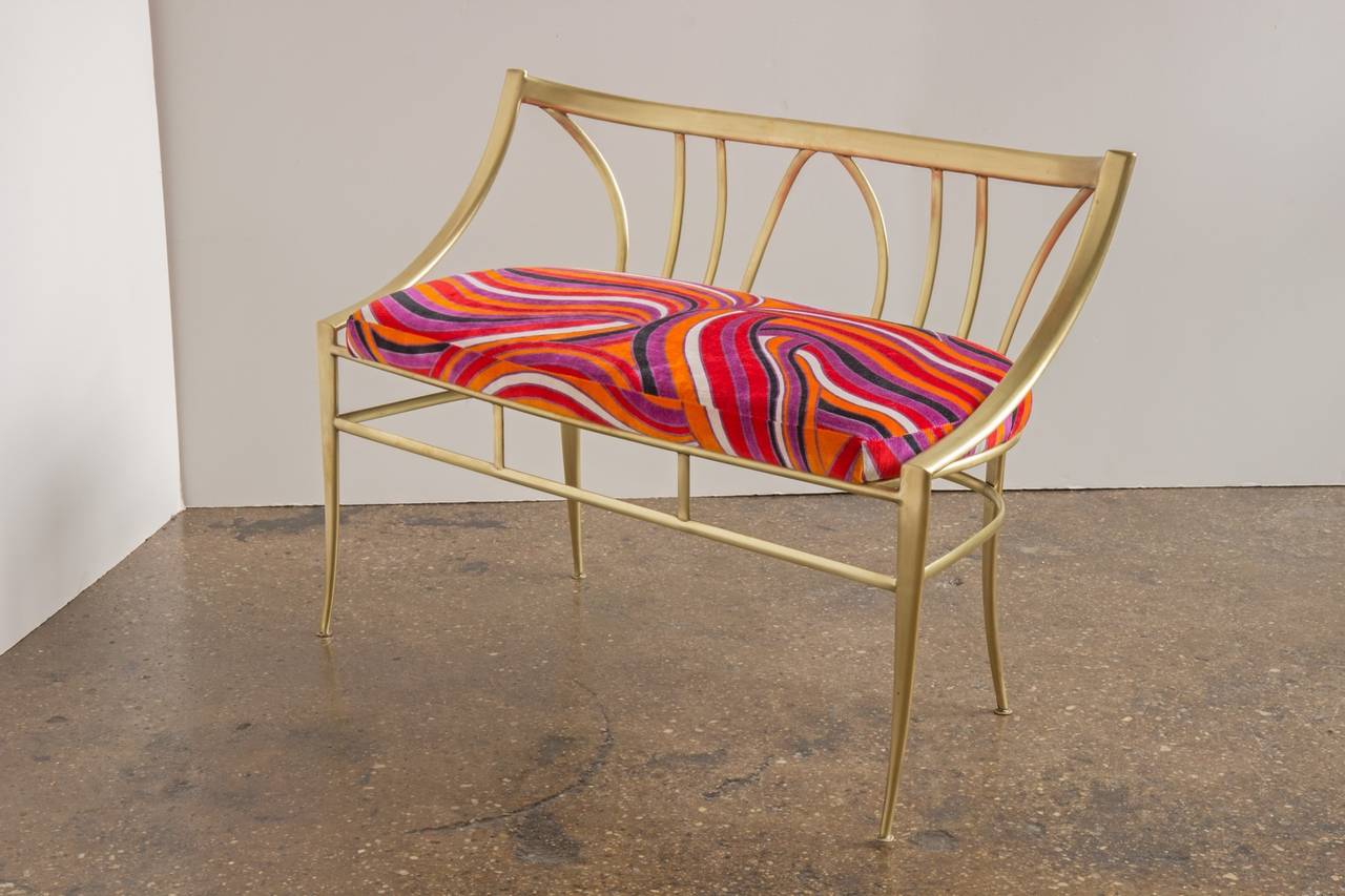 A swirling Pucci-esque velvet cushion complements our gleaming Italian brass bench. Bench dates to the 1950s and is in excellent condition. The polished brass shows a hint of desirable patina. Made in Italy. Fabric by Zinc Textiles.

Measures:
