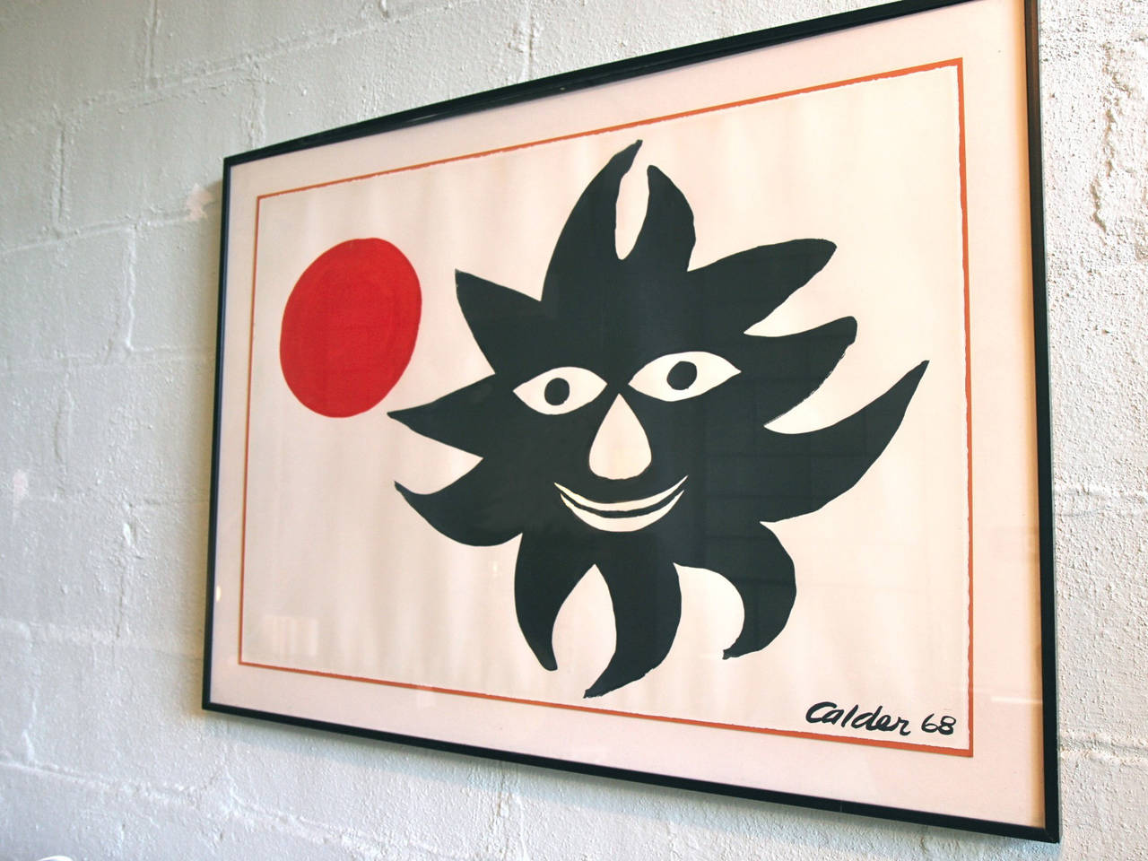 A happy smiling planet or star with red sun. Original lithograph. Signature and date in the plate reads Calder 68. In very good condition.

Print measures 24
