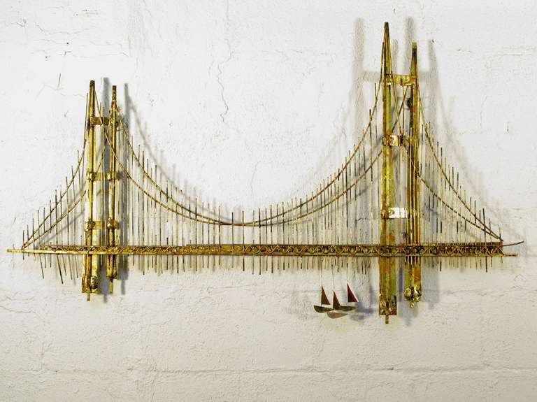 Fabulous Seventies wall art sculptures by Curtis Jeré (Artisan House). Both signed C. Jeré. One bridge is in excellent vintage condition; the other has a bit of damage to the sailboats. Metal has wonderful unique patina.

53