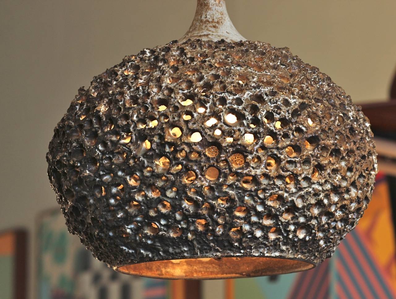 Pierced ceramic ceiling light by Mid-Century Danish modern pottery studio Sejer. This phenomenal lamp emits a dazzling chiaroscuro pattern from its pierced, crenellated surface (see photo 5). The lamp has a matching ceiling mount and about ten feet