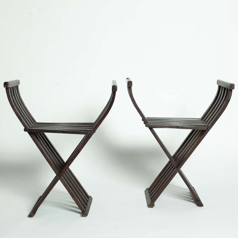 Pair of foldind chairs in spanish style.