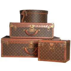 "Louis Vuitton", 20th century. A set of four hardsided luggage cases