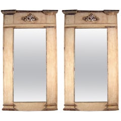 A pair of 19 th c. polycromed wood mirrors