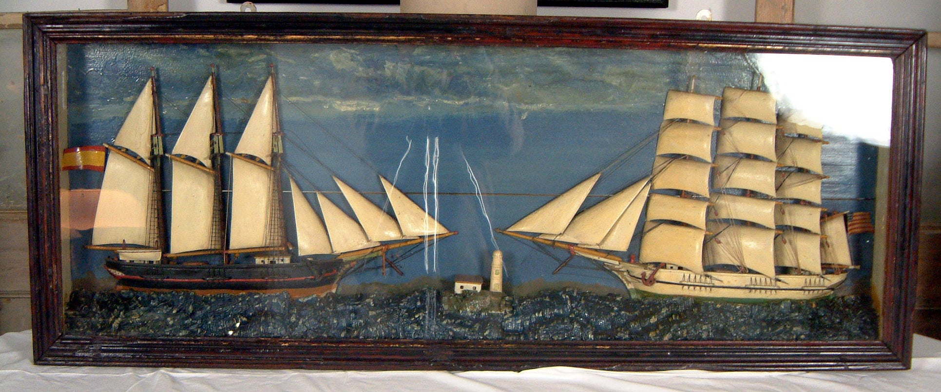 A Diorama displaying two half- hull ships.