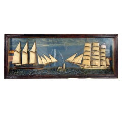 A Diorama displaying two half- hull ships.