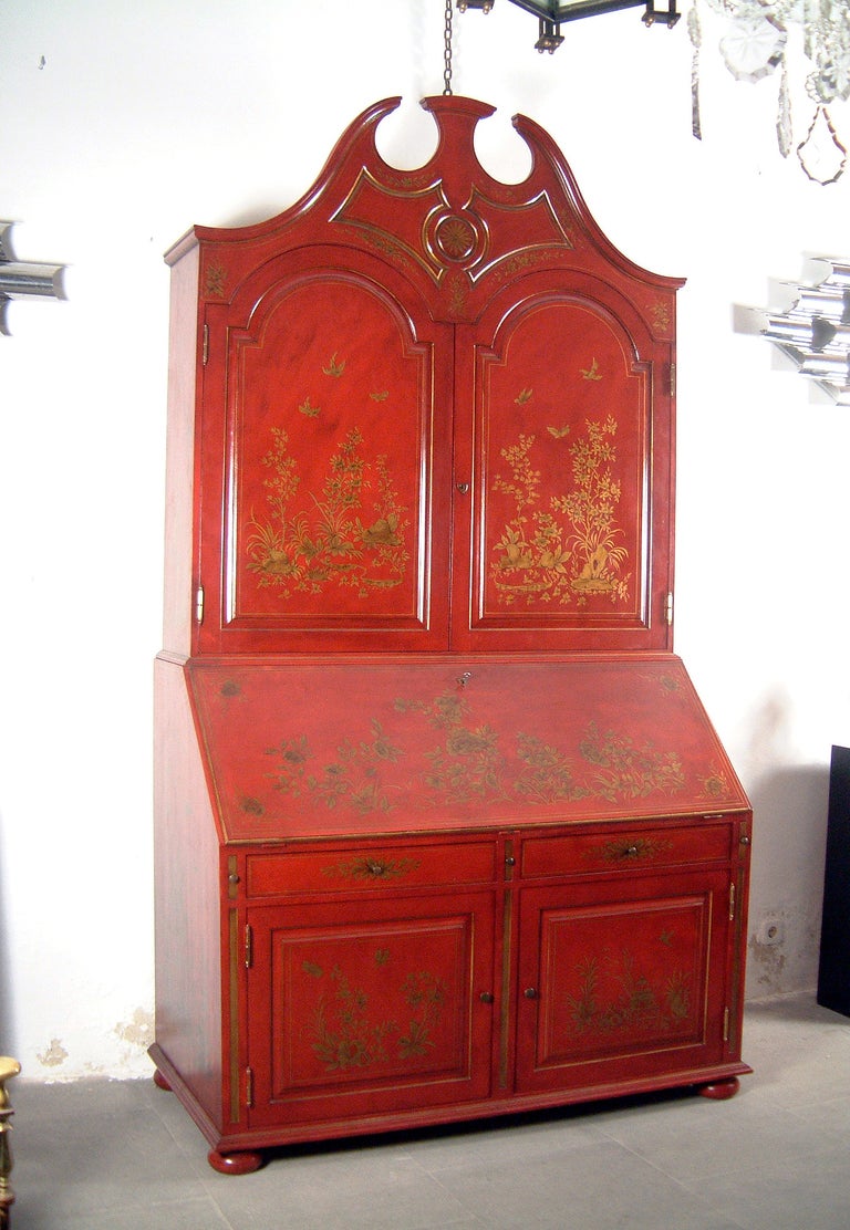 A Portuguese red lacquered and giltwood desk in the Queen Anne taste