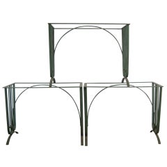 A set of five iron garden tables 11