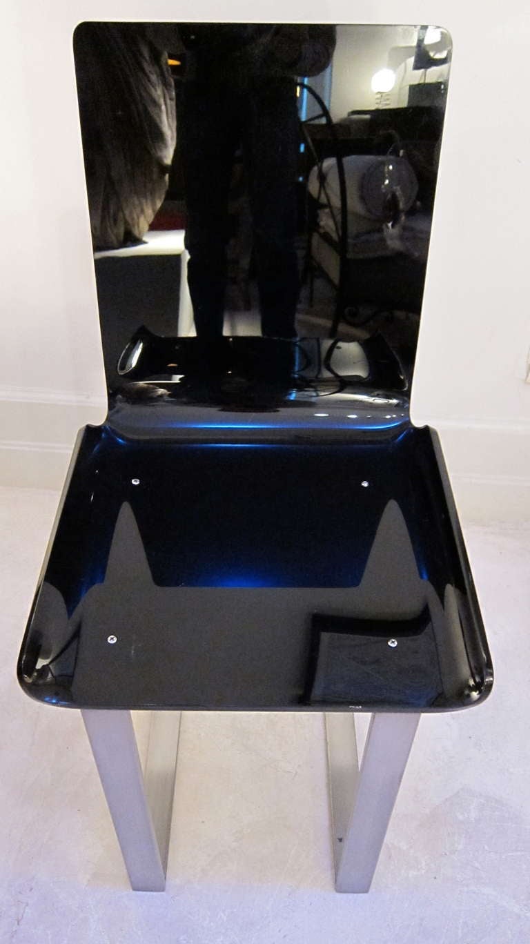 Mid-20th Century A Pair Of Chairs In Black Lucite By Marc du Plantier, Lacloche edition. For Sale