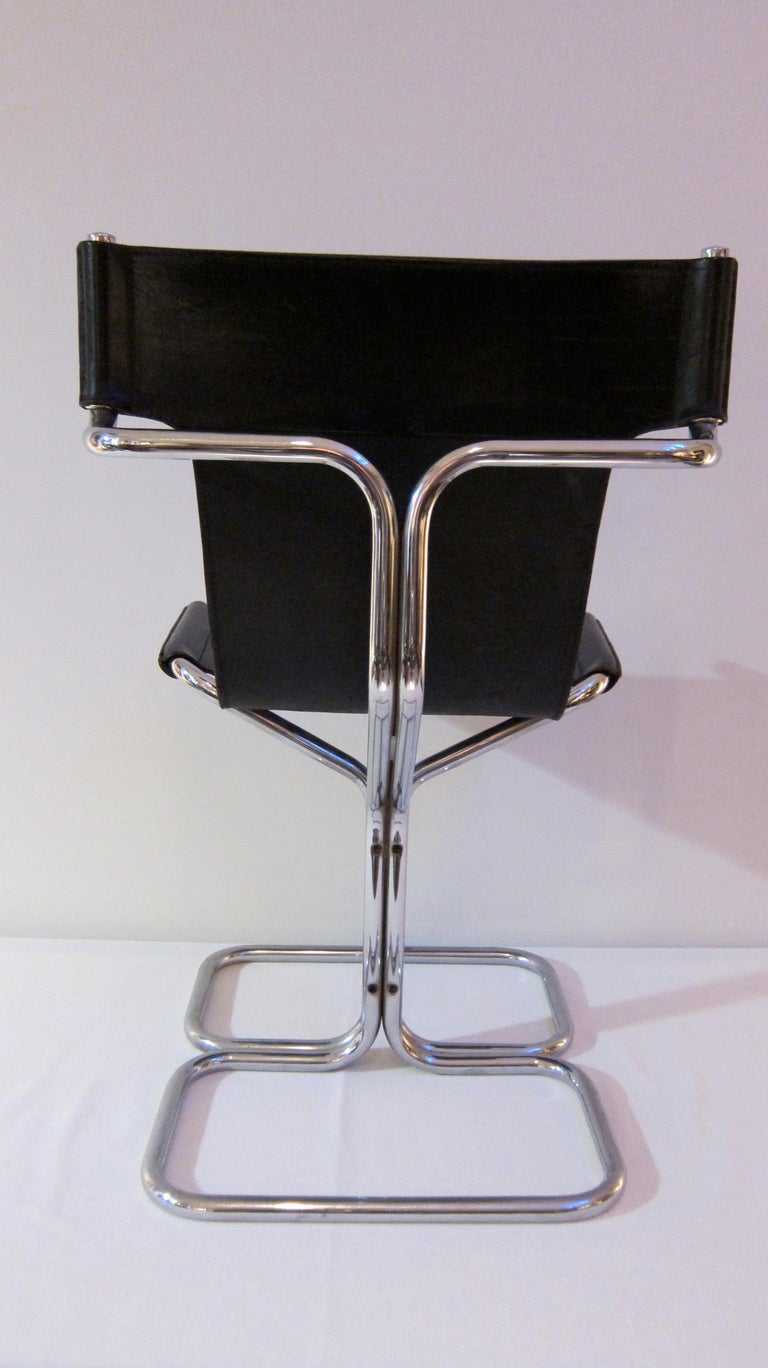 Mid-20th Century Set Of Four Tubular Chromed Steel And Black Leather Chairs. For Sale