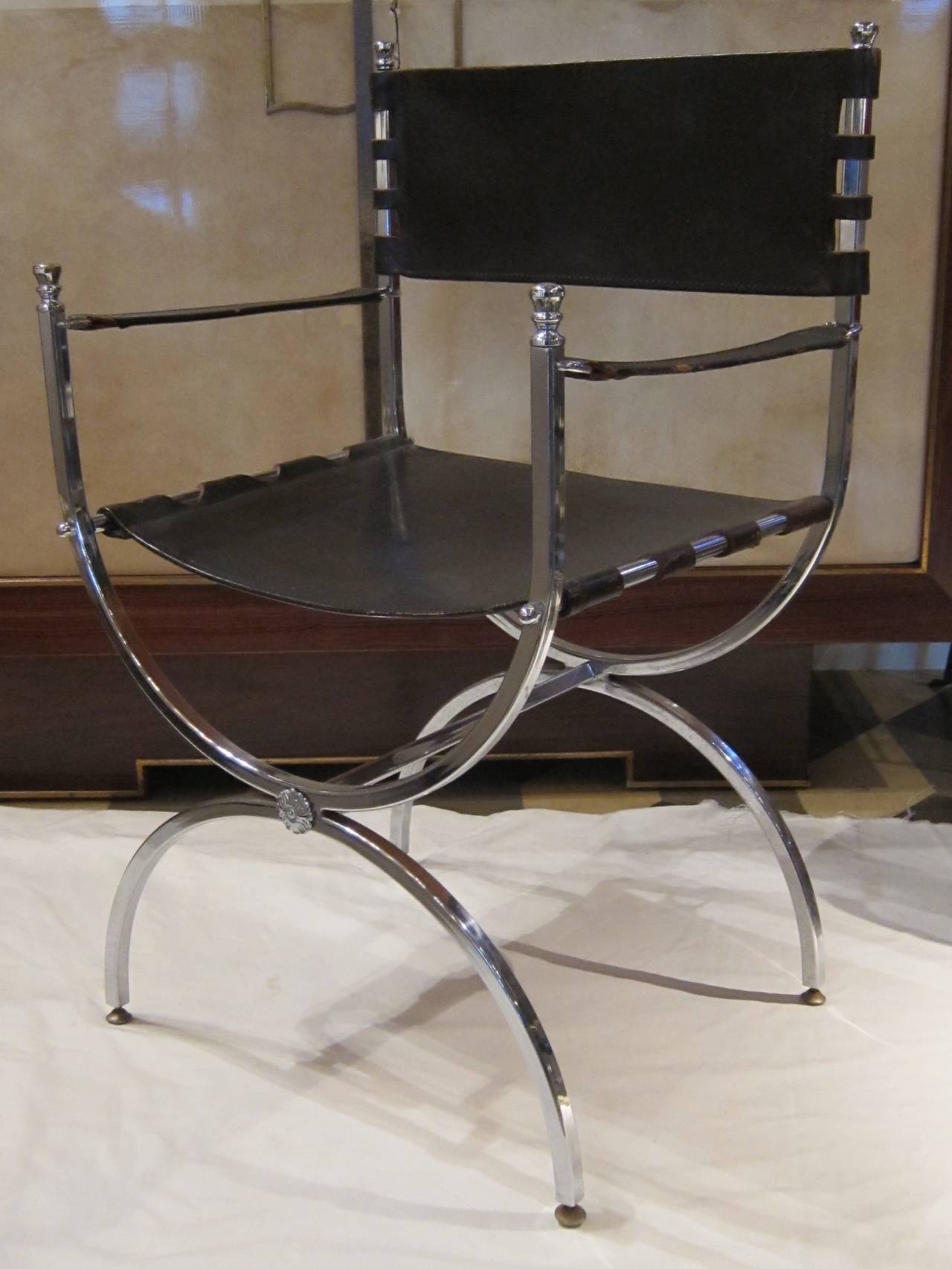 A chromed steel and leather pair of chairs by Maison Ramsay. France 40'