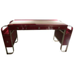 A red lacquer and chromed steel writing table. France 70
