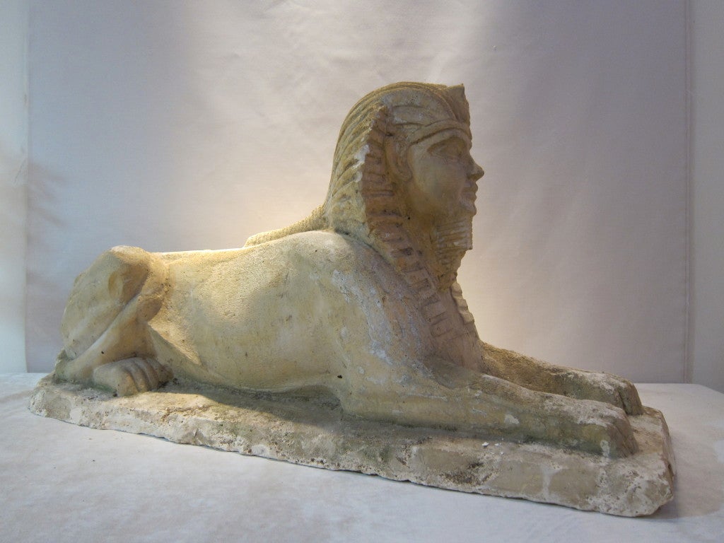 XIXth century reconstituited stone Tutankamon reclined sfinge. For Sale 1