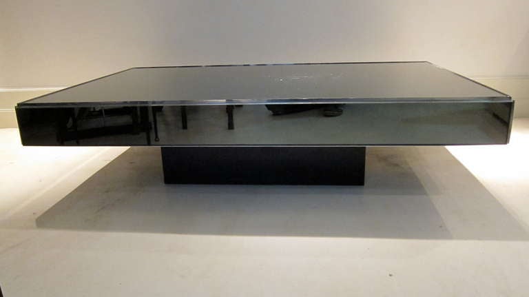 A chromed steel and dark glass coffee table ,1970