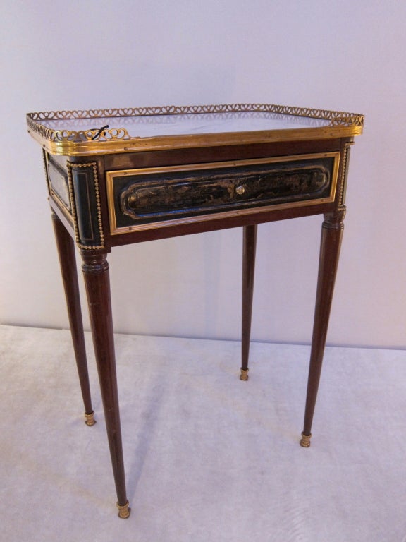 A mahogany and black lacquered Louis XVI period  side table.