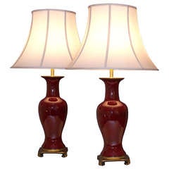 Pair of Circular Baluster Form Sang de Boeuf Lamps