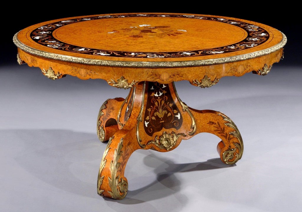 
Exhibition Quality Centre Table Firmly Attributed to Edward Holmes Baldock

Constructed primarily in Amboyna with Ebony, and having many other specimen and stained woods, bone and pearl shell used in the marquetry work, and the extensive use of