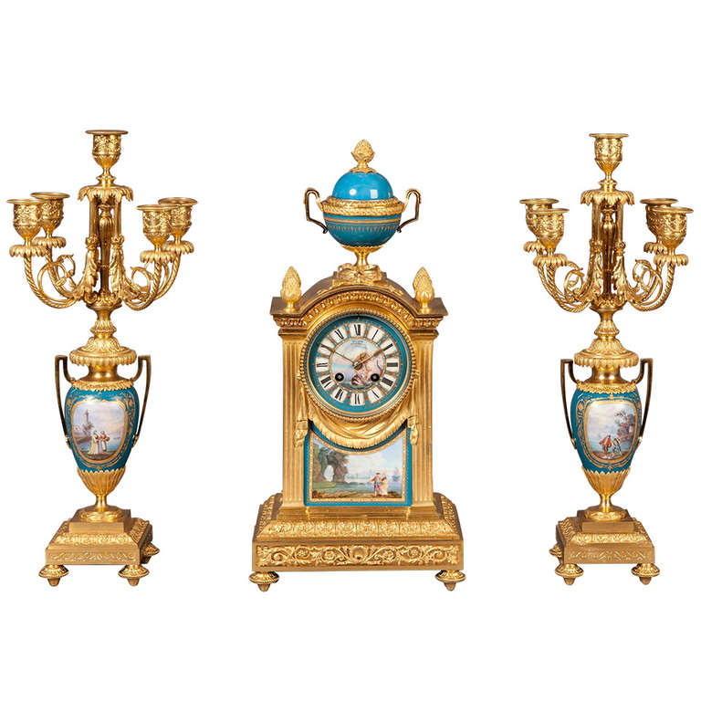 French Mantel Clock and Candelabra of Gilt Bronze and Blue ‘Sèvres